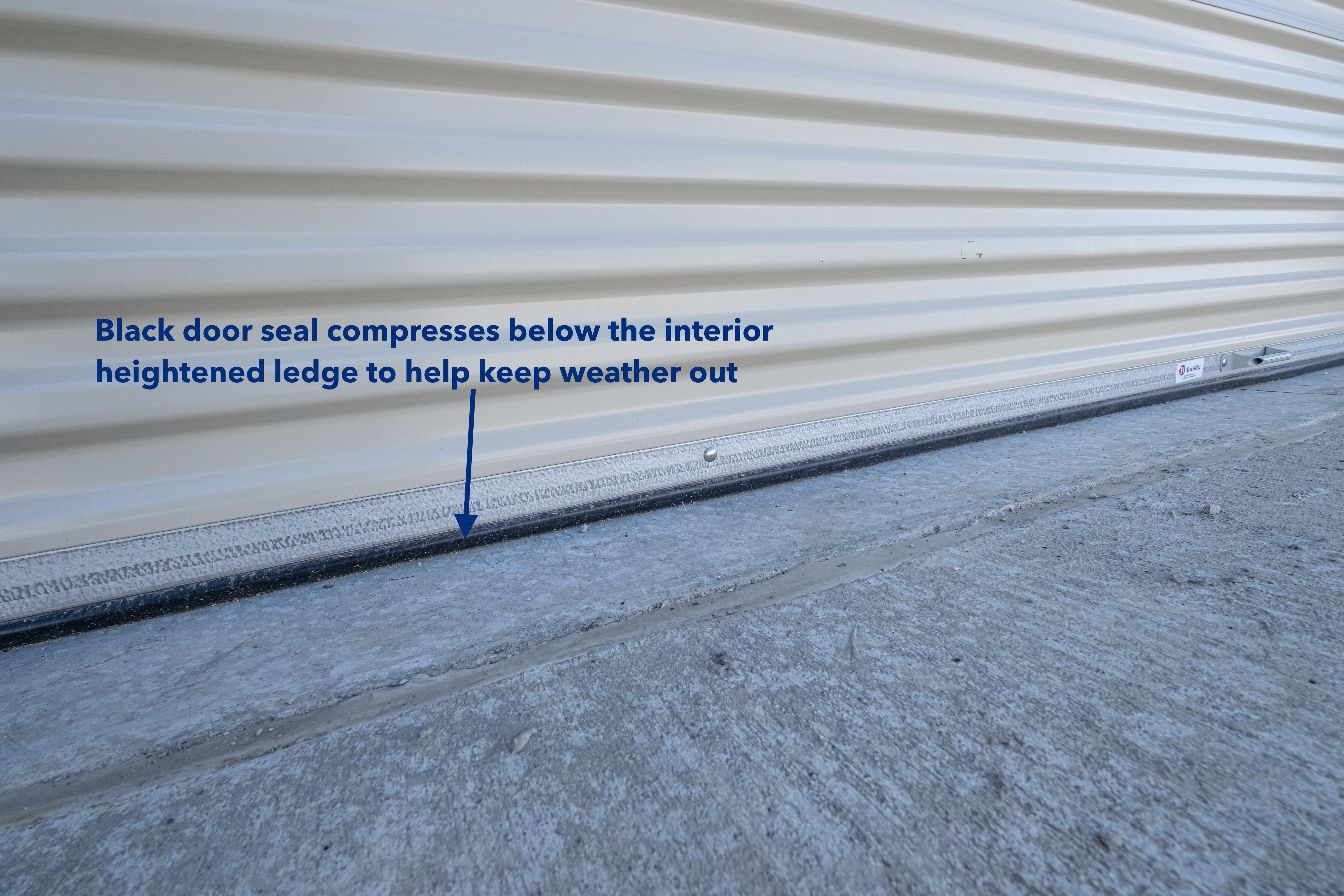 Black door seal compressed below the interior heightened ledge to help keep weather out